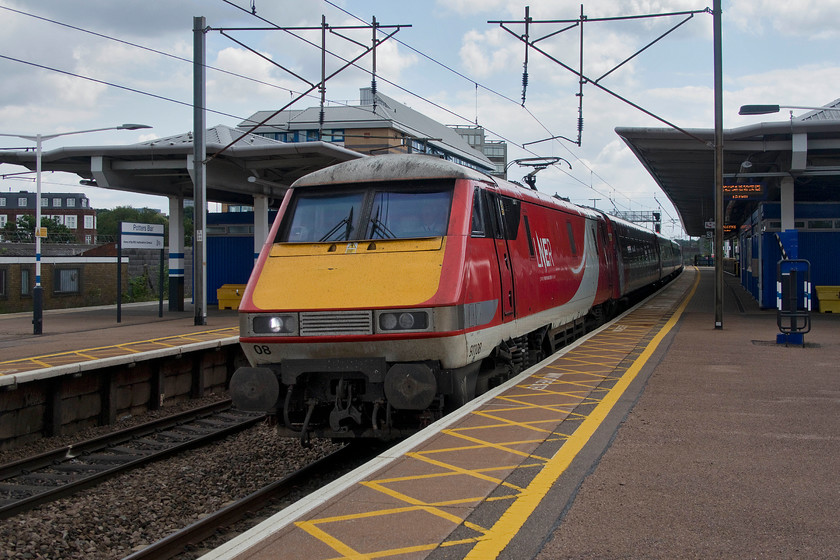 91108, GR 13.03 London King`s Cross-Leeds (1D15, 10L), Potters Bar station 
 I was of the understanding that all Leeds' services had moved over to Azuma operation. However, this one, the 13.03 off King's Cross was firmly in the hands of 91108 leading a set of Mk. IV stock. It is seen passing Potters Bar at speed being about fifteen minutes into its journey. Little did I know that a week later this locomotive would be the first of the class 91s to come off-lease and be stored to become a source of spares for the remainder of the fleet. 
 Keywords: 91108 13.03 London King`s Cross-Leeds 1D15 Potters Bar station