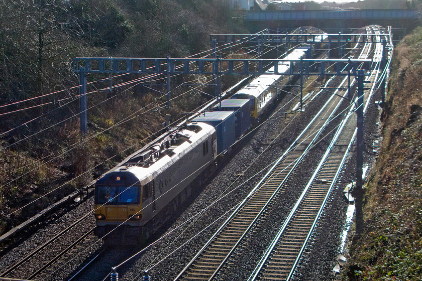 92044, 350406 (& 350407), 04.20 Dollands Moor-Trafford Park new stock move (6X50), Hyde Road bridge 
 Last year TransPennine Express (TPE) ordered a set of ten new Class 350 Desiros to operate on the Manchester, Preston route to Glasgow and Edinburgh. Capable of one hundred and ten miles per hour they are being built by Siemens Mobility at their German Krefeld factory. The first deliveries have taken place with a number of the 350/4s now in service with TPE. In this photograph, 350406 and 350407 are being towed through Roade seen from Hyde Road bridge by 92044 'Couperin' as the 6X50 04.20 Dollands Moor to Trafford Park. 
 Keywords: 92044 350406 350407 04.20 Dollands Moor-Trafford Park new stock move 6X50 Hyde Road bridge TransPennine Express Desiro Couperin