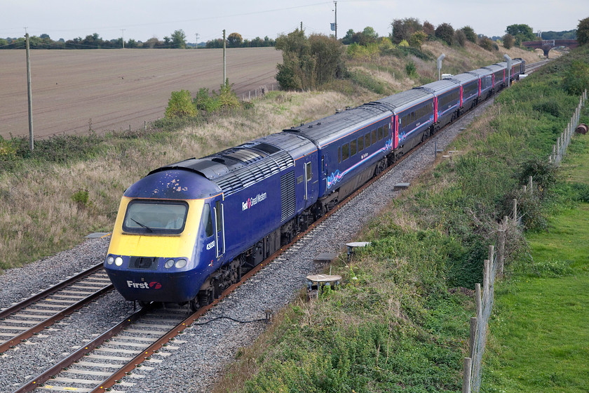 43030 & 43153, GW 11.30 London Paddington-Bristol Temple Meads (1C12), Bourton SU228874 
 43030 'Christian Lewis Trust' and 43153 power the 11.30 Paddington to Bristol Temple Meads past Bourton just east of Swindon. Note the bridge in the distance that still has its white square painted on the top left corner. This was a sighting aid and had a semaphore signal directly in front of it that was controlled by Shrivenham signal box a short distance beyond the bridge. 
 Keywords: 43030 43153 11.30 London Paddington-Bristol Temple Meads 1C12 Bourton SU228874