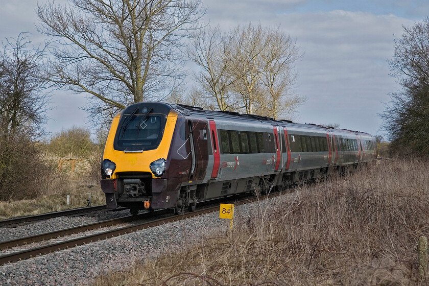 220033, XC 06.25 Newcastle-Reading, King's Sutton SP486377 
 220033 passes just north of a chilly King's Sutton working the 06.25 Newcastle to Reading service. The Voyagers have been in service for just over ten years now with Cross Country being their second operator. A reminder of its years with Virgin is still to be seen just below the windscreen with the outline of their crest still clear to see on the yellow paint. Notice the milepost indicating eighty-four miles. This is the distance from Paddington via the GWR route through Oxford and Didcot rather than to Marylebone. 
 Keywords: 220033 Cross Country 06.25 Newcastle-Reading, King's Sutton SP486377 Voyager