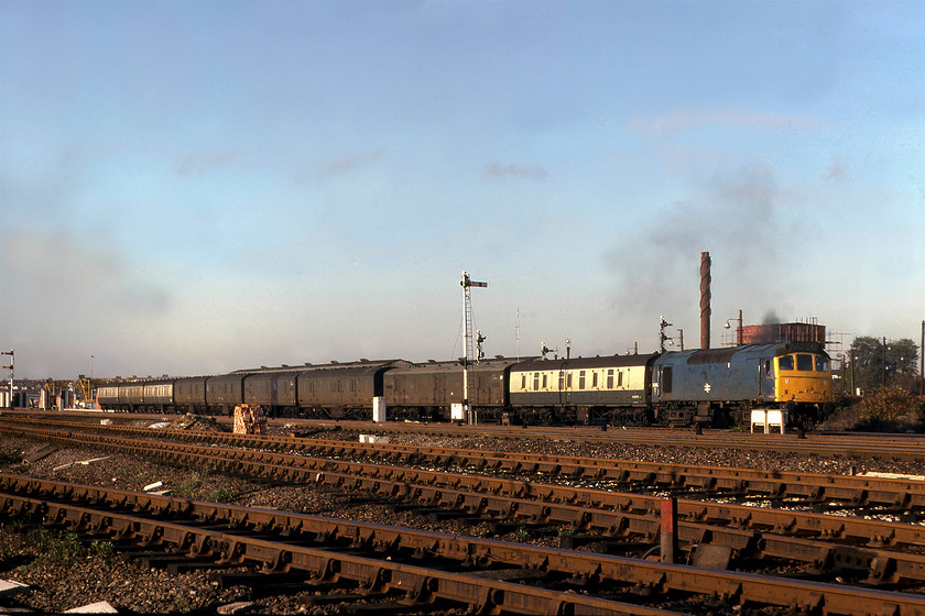 25280, shunting parcels, Cricklewood yard 
 You can almost here the rattling from the Sulzer 6LDA28-B engine as 25280 gets its parcels train under way in Cricklewood yard. The consist has a delightfully eclectic mix of vans including three LMS series III vans, M31340, M0314 and M31374. These would have been built at Wolverton works during the early 1940s. 25280 had another two years in service until withdrawal came with it being cut up at Swindon 
 Keywords: 25280 Cricklewood yard