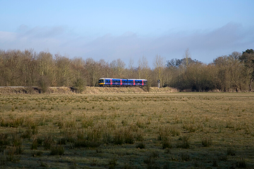 166220, GW 07.53 Oxford-Banbury (2L38), King's Sutton SP498354 
 First Great Western's 166220 slows for its stop at King's Sutton which is just a short distance through the trees to the right working the 2L38 07.53 Oxford to Banbury local stopper. Whilst most services are worked by two-car units on Saturday a three-car usually works the train. 166220 is usually formed as a three-car set but the middle coach 58620 appears to have been removed; reason unknown! 
 Keywords: 166220 07.53 Oxford-Banbury, King's Sutton SP498354 First Great Western 2L38