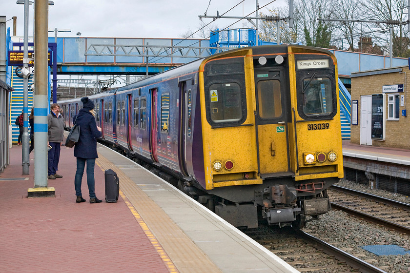 313039, GN 08.29 Welwyn Garden City-London King's Cross (2Y17), Alexandra Palace station 
 313039 arrives at Alexandra Palace station working the 08.29 Welwyn to King's Cross service. Now approaching their fifth decade of operation I well remember in 1977 when I travelled on one of these units from King's Cross to Finsbury Park in my quest to spot Deltics. I recall being very impressed with trains then in particular with their revolutionary sliding doors! 
 Keywords: 313039 08.29 Welwyn Garden City-London King's Cross (2Y17), Alexandra Palace station Great Northern