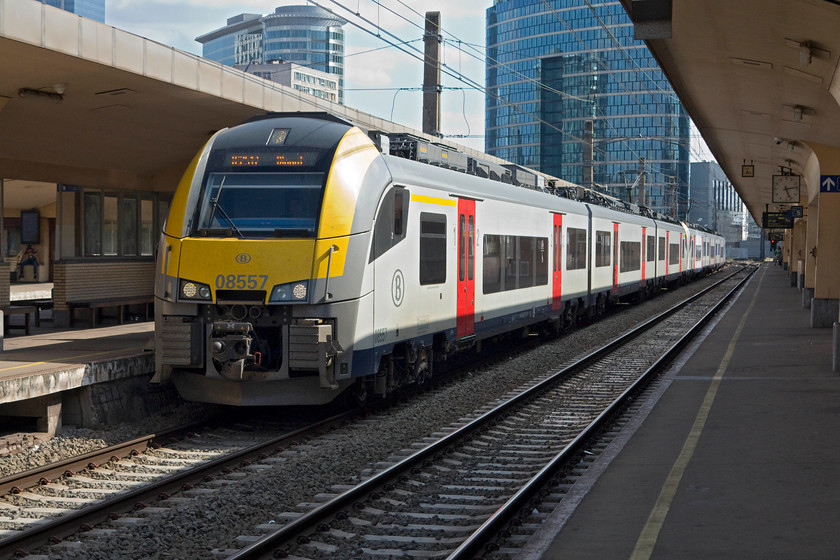 08 557, 17.03 Brussels Midi-Dinant (IC 2517), Brussels Nord station 
 SNCB class 08 Siemens Desiro EMU number 08557 and a stablemate arrives into Brussels Nord station with the 17.03 Brussels Midi to Dinnant. Dinnat is about sixty miles south of Brussels and is a stunning riverside medieval town with a dramatic cliff backdrop. As a child I went there with my family and well remember trying to bite on one their lovely looking couque de Dinant biscuits only to find it was doing its best to break my teeth; their accolade is that they are Europe's hardest biscuit! 
 Keywords: 08 557 17.03 Brussels Midi-Dinant IC 2517 Brussels Nord station