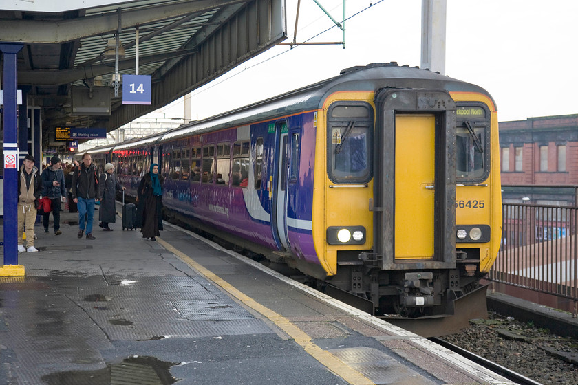 156425, NT 12.29 Manchester Airport-Blackpool North (1N62), Manchester Piccadilly station 
 My third train of the day from Manchester Piccadilly to Bolton. 156425 arrives at platform 14 with the 12.29 Manchester Airport to Blackpool North. This service will go over to electric power when (if ever?) the long awaited north western electrification programme is completed. During my journey, I saw limited evidence of pilings and masts in place northwards from Windsor Bridge Junction so diesel power will reign for a fair while to come. 
 Keywords: 156425 12.29 Manchester Airport-Blackpool North 1N62 Manchester Piccadilly station