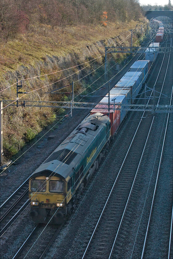 66510, 07.50 Felixstowe North-Lawley Street (4M94, 200L), Roade cutting 
 At this point in its journey, the 07.50 Felixstowe to Lawley Street 4M94 Freightliner was running almost to time as it passed through Roade cutting led by 66510. Unfortunately, close to its destination just past Water Orton at Castle Bromwich Junction, something went badly wrong with eventual arrival being over three hours late! 
 Keywords: 66510 07.50 Felixstowe North-Lawley Street 4M94 Roade cutting Freightliner