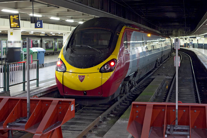 390153, VT 19.30 London Euston-Glasgow Central (1S06), London Euston station 
 The final northbound Anglo Scottish service of the day stands at Euston's platform six. 390153 should arrive at Glasgow early the next day with the 19.30 from Euston. 
 Keywords: 390153 19.30 London Euston-Glasgow Central 1S06 London Euston station