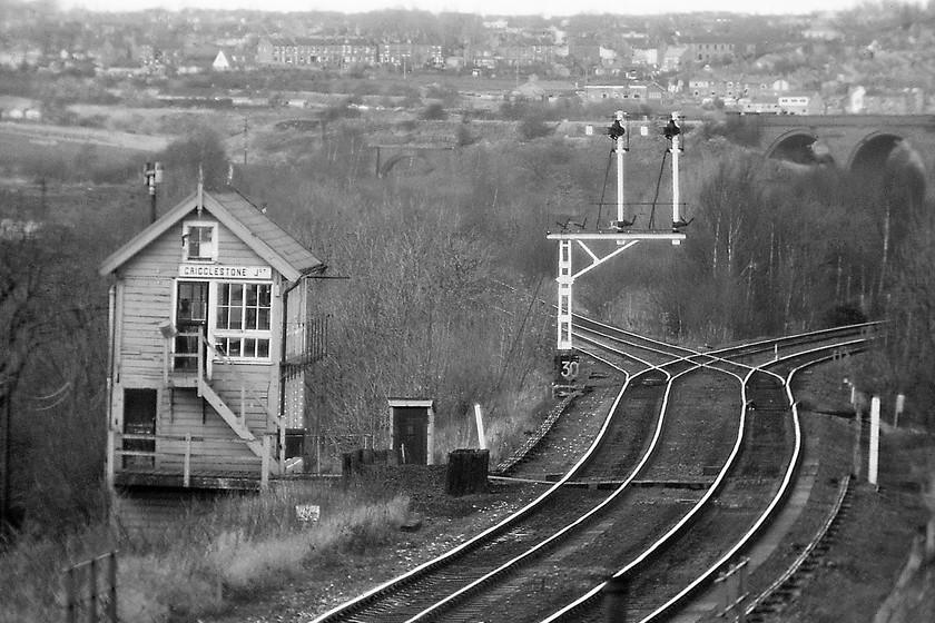 Crigglestone Junction signal box (L&Y, 1901) 
 Taken with my telephoto lens and enlarged from the centre of the original Crigglestone Junction signal box is seen standing on Bretton Lane bridge. The junction can be seen with the lines to the left going west towards Horbury Station Junction and just beyond that Healey Mills. This line was already a freight-only chord when this photograph was taken and is now lifted but, interestingly, it is still shown on the latest edition of the Ordnance Survey 1:50000 map. The line to the right is the L & Y route linking Sheffield to Wakefield via Barnsley. In the background is the large Crigglestone viaduct that still dominates the valley that carried the Midland route that terminated at Dewsbury. Crigglestone signal box was a Lancashire and Yorkshire box that survived until January 1997 with control moving to Horbury Junction, see..... https://www.ontheupfast.com/p/21936chg/28462368004/horbury-junction-signal-box-lnwr 
 Keywords: Crigglestone Junction signal box Lancashire and Yorkshire Railway