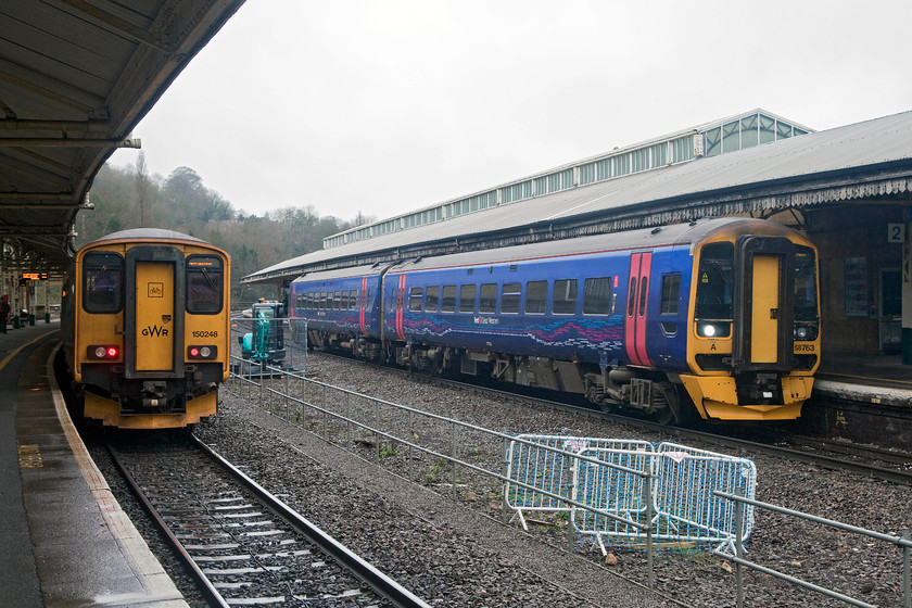 153368 & 150248, GW 08.53 Weymouth-Bristol Temple Meads (2V88, 2E) & 158763, GW 08.50 Great Malvern-Westbury (2F97, RT), Bath Spa station 
 A meeting of units at Bath Spa. 150248 at the back of the 08.53 Weymouth to Bristol Temple Meads whilst 158763 arrives with the 08.50 Great Malvern to Westbury. Notice the evidence of the impending preparations for the platform works in order to accommodate the class 800s. The would necessitate the closure of Bath station over the Easter period of 2017. 
 Keywords: 153368 150248 2V88 158763 2F97 Bath Spa station