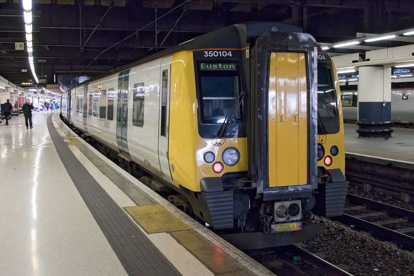 350104, LN 13.15 London Euston-Rugeley Trent Valley & Crewe (Cancelled from Northampton) (1Y17 & 2H68, 2L), London Euston station 
 With its recently applied paint shining well, London Northwestern's 350104 waits at Euston to leave with the 13.15 to Rugeley Trent Valley and Crewe with the train splitting on arrival at Birmingham New Street. My wife and I took this service back home to Northampton where, unfortunately, it was cancelled. The guard announced that the cause of this cancellation was due to a broken down train between Northampton and Rugby meaning that the train crew were unable to take the train on. Whilst in BR days trains broke down all too frequently, the knock-on results of a failure were far less due to them having far greater levels of flexibility over things such as 'train crews being in the wrong place'. 
 Keywords: 350104 13.15 London Euston-Rugeley Trent Valley Crewe Cancelled from Northampton 1Y17 2H68 London Euston station London Northwestern Desiro