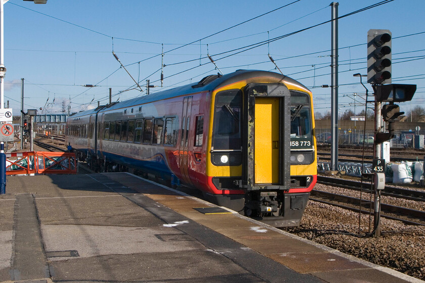 158773, EM 08.34 Nottingham-Norwich, Peterborough Station 
 158773 drifts into Peterborough station working the 08.34 Nottingham to Norwich. I have to question if a two-car DMU is adequate for this inter-regional working? In the not-too-distant past, this would have been composed of a rake of Mk. 1 or 2 stock hauled by a Class 31....progress; I'll let you decide! 
 Keywords: 158773 08.34 Nottingham-Norwich Peterborough Station East Midlands Trains