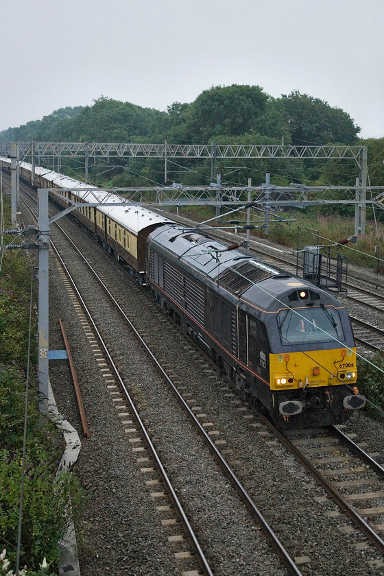 67006, 05.17 Stewart's Lane-Cheltenham (5Z25), site of Roade station 
 On a very dull and wet Saturday morning 67006 'Royal Sovereign' leads the 5Z25 05.17 Stewart's Lane to Cheltenham empty coaching stock. This ECS move was associated with a later charter picking up passengers from Cheltenham and Bristol Parkway heading to Southampton looking forward to a luxury cruise. The train was to travel via the GWML to Bathampton Junction and then through the Avon Valley to Westbury and then south through Salisbury. After its passengers disembarked at Southampton Central the empty stock then returned directly to Stewart's Lane for stabling. 
 Keywords: 67006 05.17 Stewart's Lane-Cheltenham 5Z25 site of Roade station Royal Sovereign