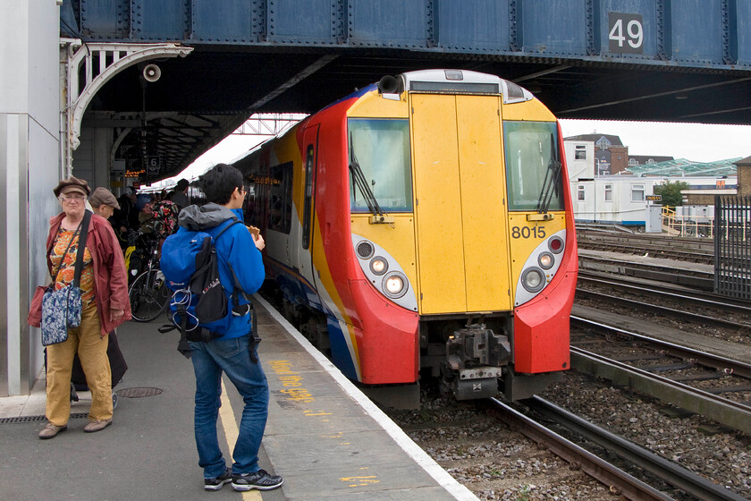 458015, SW 14.20 London Waterloo-Reading (14.28 Clapham Junction-Sunningdale) (2C41), Clapham Junction station 
 The final train of my somewhat tricky journey from Northampton to Sunningdale arrives at Clapham Junction. This would be my first trip on a Class 458 working the 14.20 Waterloo to Reading 2C41 service. I found 458015 comfortable and fast accelerating but the tiny destination screen at the top of the interconnecting door panel is worse than useless! 
 Keywords: 458015 14.20 London Waterloo-Reading 2C41 Clapham Junction station South West Trains