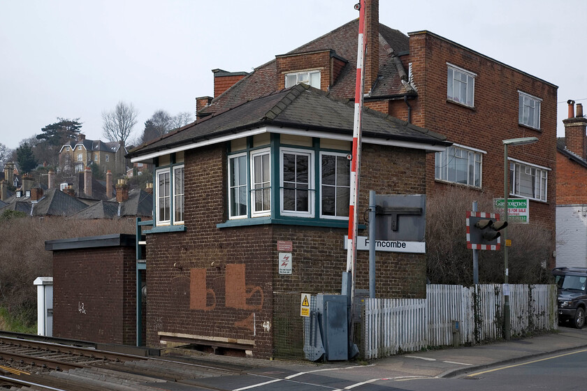 Farncombe signal box (LSW, 1897) 
 Farncombe signal box is located to the south of the station where a road crosses the railway. The remains of the long disused McKenzie and Holland frame is apparently in the locking room being stamped 'L&SWR 1896' with the installation of a 'cooker switch' panel having made it redundant in 1986. The box is typical of the L&SWR being constructed in 1897. At present I have no date for its replacement but I suspect that it won't be too long before re-signalling catches up with it. 
 Keywords: Farncombe signal box LSW London and South Western Railway