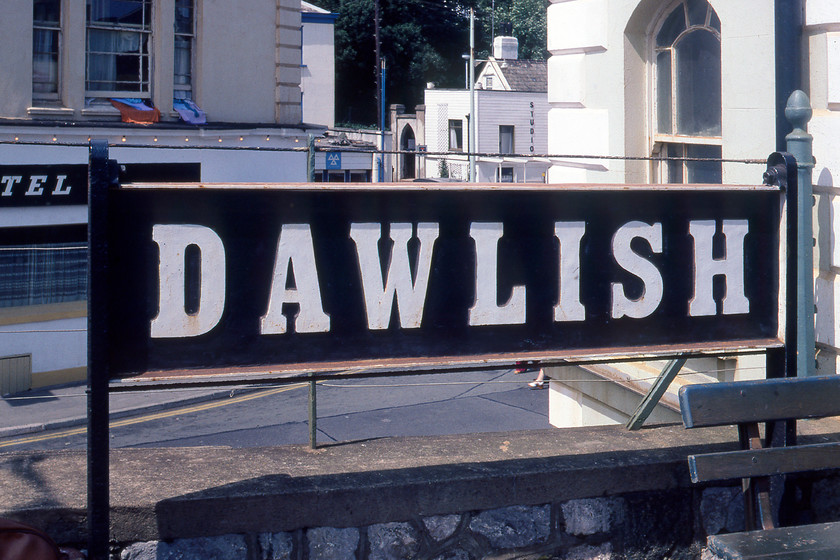 Ex GWR, sign, Dawlish station 
 A former GWR running in sign at Dawlish station that is still extant today. The hotel in the background is now a charity shop and the MoT facility behind that is now flats. Strangely, the oddly designed building next to the archway is still virtually identical now named Bay View Cottage. 
 Keywords: Ex GWR, sign Dawlish station