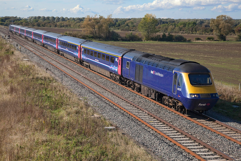 43032 & 43180, GW 12.36 Cheltenham-London Paddington (1L58), Bourton SU228874 
 43032 and 43180 race eastwards past the village of Bourton with the 12.36 Cheltenham Spa to Paddington. Whilst 43180 was a late delivery in 1982, 43032 was one of the first HSTs being part of 253016 that entered service in the autumn of 1976. 
 Keywords: 43032 43180 12.36 Cheltenham-London Paddington 1L58 Bourton SU228874