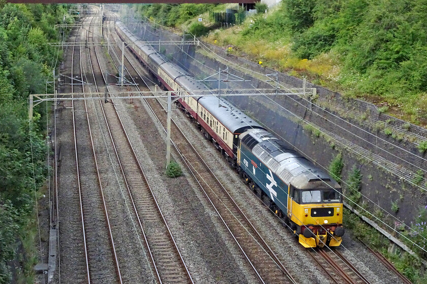 47593, 14.17 Northampton DGL-Southall WCR (5Z63, 14L), Roade cutting 
 Following yesterday's successful English Riviera Express operated by Saphos Trains the train was stabled overnight at Northampton, its start and finish point. Now running as 5Z63 the 14.17 Northampton to Southall WCR empty stock train is seen climbing through Roade cutting with 47593 'Galloway Princess' leading. 
 Keywords: 47593 14.17 Northampton DGL-Southall WCR 5Z63 Roade cutting Galloway Princess