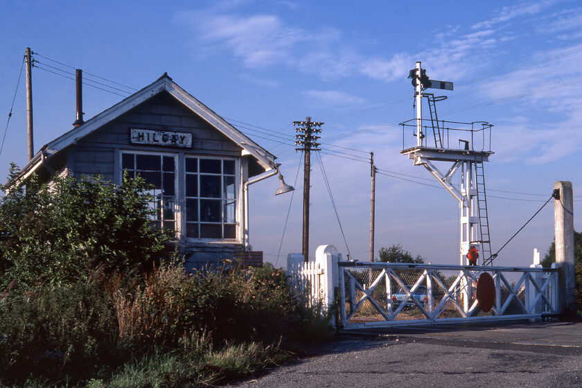 Hilgay signal box (LNER, c.1925) 
 An antiquated scene at Hilgay that could well be dating from a much earlier era only dated by the signalmans Mk. IV Cortina in the background. Hilgay box was installed by the LNER around 1925 when the company was undertaking a cost-saving exercise by rationalising their signalling; sounds familiar doesnt it! This box and frame were actually second-hand when erected here but, as eagle-eyed readers will have noted, it would have come from the Great Eastern as it is actually one of their 1881/2 designs. Its original location prior to being here at Hilgay remains unknown. The box was closed in 1982 just two years after this photograph was taken when the block post was extended to run between Downham Market and Littleport was created and the manual gates automated. 
 Keywords: Hilgay signal box LNER