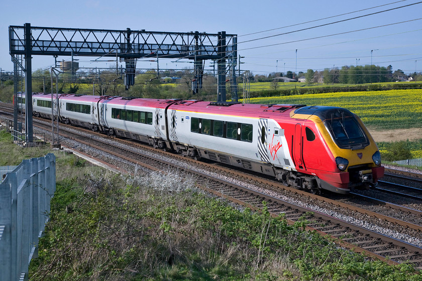 221108, VT 15.33 Chester-London Euston (1A51), Roade Hill 
 The 15.33 Chester to Euston Virgin West Coast train seeds past Roade hill being worked by Voyager 221108 'Sir Ernest Shackleton'. The installation of the dreaded palisade fencing last autumn has really spoilt this spot that now requires the use of a ladder to elevate the camera above and beyond the fencing. 
 Keywords: 221108 15.33 Chester-London Euston 1A51 Roade Hill Sir Ernest Shackleton Virgin West Coast Voyager