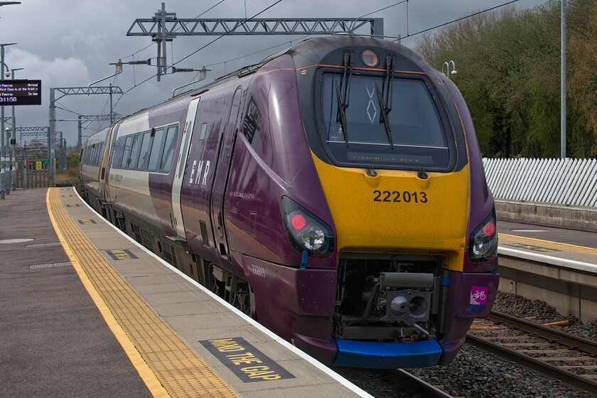 222013, EM 09.12 Nottingham-London St. Pancras (1B28), Kettering station 
 Under a dramatic and looming sky at Kettering station Meridian 222013 leaves the station working the 1B28 Nottingham to St. Pancras service. The train is seen in a little weak sunshine that was actually the only bit of brightness we saw throughout the day that deteriorated to the point where Andy and I got absolutely drenched later whilst walking back to Leicester station! 
 Keywords: 222013 09.12 Nottingham-London St. Pancras 1B28 Kettering station EMR EMT Meridian