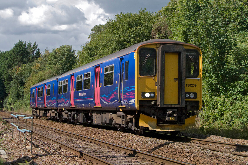 150239, GW 10.41 Gloucester-Weymouth (2O89), Bradford-on-Avon number 1 crossing 
 150239 slows on the approach to Bradford-on-Avon taken from a foot crossing just west of the station. It is working the 2O89 10.41 Gloucester to Weymouth service. As a young spotter in the 1970s, I spent many hours collecting numbers at this and a number of other locations close to Bradford-on-Avon. 
 Keywords: 150239 10.41 Gloucester-Weymouth 2O89 Bradford-on-Avon First Great Western