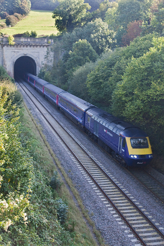 43186, GW 10.00 Paddington-Paignton (1C09), A4 road bridge, Box 
 It looks like Network Rail need to get a tree clearance team down into Box cutting and to cut back the uncontrolled growth that is now brsuhing the sides of the trains as they pass. It really is not good enough that on one of the country's prinicple main lines this kind of poor maintenance prevails. 43186 leads the 10.00 Paddington to Paignton as it exits from the western portal of Box tunnel. 
 Keywords: 43186 10.00 Paddington-Paignton 1C09 A4 road bridge, Box