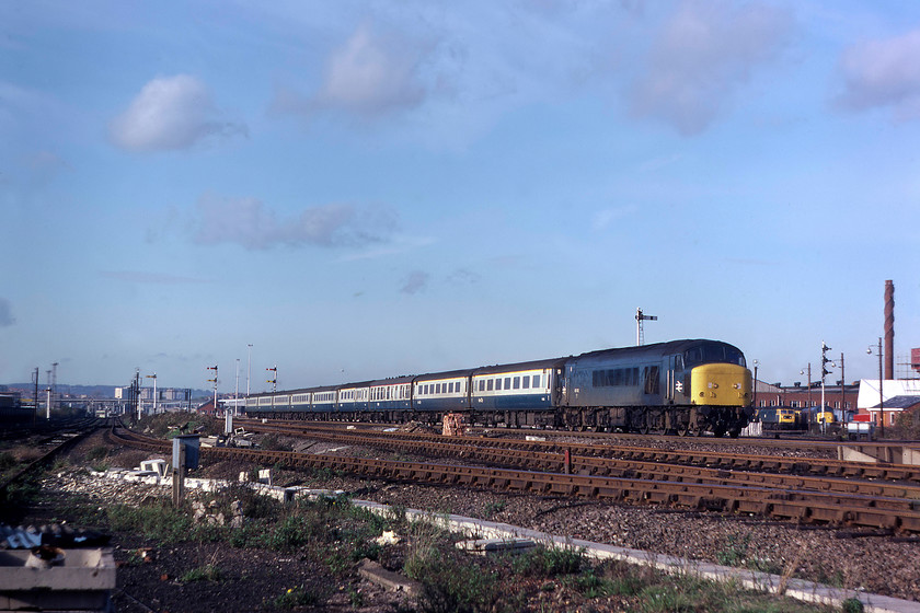 Class 45, 11.00 Sheffield-London-St.-Pancras, Cricklewood yard 
 The 11.00 Sheffield to St. Pancras, led by an unidentified class 45, approaches Crickelwood passing the now-demolished depot to its right. The vast expanse of Brent Yard stretches out into the distance. I am not at all sure how Graham and I managed to remain unchallenged in the yard taking pictures and cannot remember how we gained access? 
 Keywords: Class 45 11.00 Sheffield-London-St.-Pancras Cricklewood yard