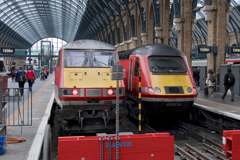 82206, GR 13.30 London King`s Cross-Edinburgh (1S49, 5L) & 43309, GR 14.00 London King`s Cross-Aberdeen (1S20, 1E), London King`s Cross station 
 On arrival at King's Cross everything seemed as it had been for many years with no signs of any Azumas, in fact during my hour stay I observed no class 800s. In this photograph, passengers and crew make their way along platform six to board the 13.30 to Edinburgh with 82206 at the rear. Meanwhile, to the right, 43309 will be at the rear of the 1S20 14.00 to Aberdeen. 
 Keywords: 82206 13.30 London King`s Cross-Edinburgh 1S49 43309 14.00 London King`s Cross-Aberdeen 1S20 London King`s Cross station