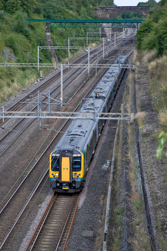 350107 & 350117, LM 08.54 Birmingham New Street-London Euston (2Y60), Roade cutting 
 350107 and 350117 pass south through Roade cutting working the 08.54 Birmingham New Street to London Euston. 
 Keywords: 350107 350117 08.54 Birmingham New Street-London Euston 2Y60 Roade cutting London Midland Desriro