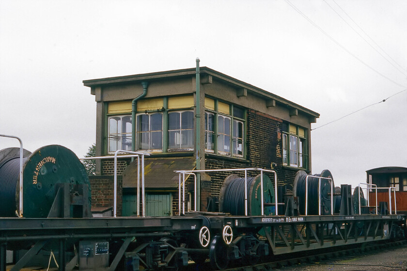 Salisbury West signal box (LSW, 1902) 
 The rear of Salisbury West signal box just nine days prior to its closure. The reeled cabling in the foreground was probably associated with the resignalling of the area. Notice the period brake van at the rear of the train. I would visit the box one more time a few days after this photograph was taken, this time with Graham. 
 Keywords: Salisbury West signal box L&SWR London and South Western Railway