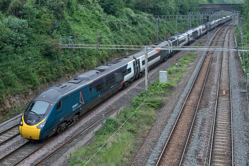 390123, VT 12.47 Wolverhampton-London Euston (1B26, 2L), A508 road bridge 
 Just exiting the southern end of Roade cutting 390123 works the 12.47 Wolverhampton to Euston Avanti service. The photograph is taken from the village's A508 road bridge. 
 Keywords: 390123 12.47 Wolverhampton-London Euston 1B26 A508 road bridge Roade Avanti West Coast