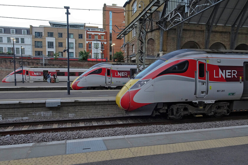 801217, GR 16.30 Edinburgh Waverley-London King's Cross (1E23, 3L), 801222, GR 21.17 London King's Cross-Bounds Green (5Y22, 24E) & 801201, GR 21.00 London King's Cross-Newcastle (1N34, 6L), London King's Cross station 
 The latest lineup of trains at King's Cross pokes their noses out from the station roof. Furthest to nearest they are....

801217 - 16.30 Edinburgh Waverley-London King's Cross -1E23.
801222 - 21.17 London King's Cross-Bounds Green - 5Y22.
801201 - 21.00 London King's Cross-Newcastle - 1N34.

Whilst the Azumas now dominate services there are still a number of IC225 sets still in operation on the Leeds route. 
 Keywords: 801217 16.30 Edinburgh Waverley-London King's Cross 1E23 801222 21.17 London King's Cross-Bounds Green 5Y22 801201 21.00 London King's Cross-Newcastle 1N34 London King's Cross station