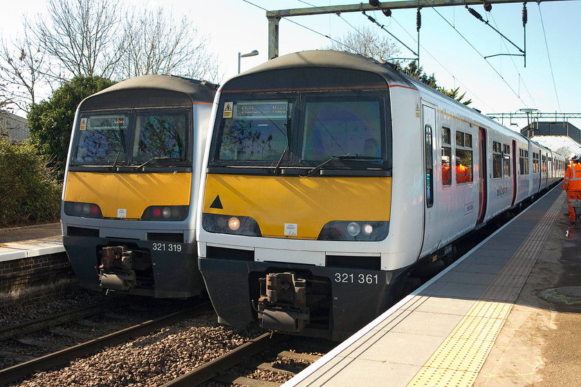 321361, LE 10.56 Colchester-Walton-on-the-Naze (2F32) & 321319, LE 11.00 Walton-on-the-Naze-Colcehster (2F35), Great Bentley station 
 I travelled from Colchester on 321361 working the 10.56 to Walton-on-the-Naze. It is seen here at Great Bentley next to 321319 working the corresponding 11.00 from Walton to Colchester. 
 Keywords: 321361 10.56 Colchester-Walton-on-the-Naze 2F32 321319 11.00 Walton-on-the-Naze-Colcehster 2F35 Great Bentley station