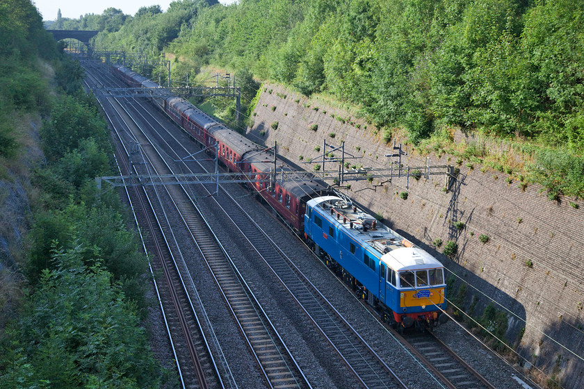 86259, outward leg of The Cumbrian Mountain Express, 07.10 London Euston-Carlisle (1Z86), Roade Cutting 
 86259 'Les Ross/Peter Pan' brings the the Cumbrian Mountain Express through Roade Cutting. It working the outward leg from Euston to Carlisle running as the customary 1Z86. This celebrity class 86 is finished in its original electric blue livery and it is kept very smart by the team that operate it. It has been very reliable and can always be called on to do the business on the busy WCML where it is most at home! 
 Keywords: 86259 outward leg of The Cumbrian Mountain Express 07.10 London Euston-Carlisle 1Z86 Roade Cutting