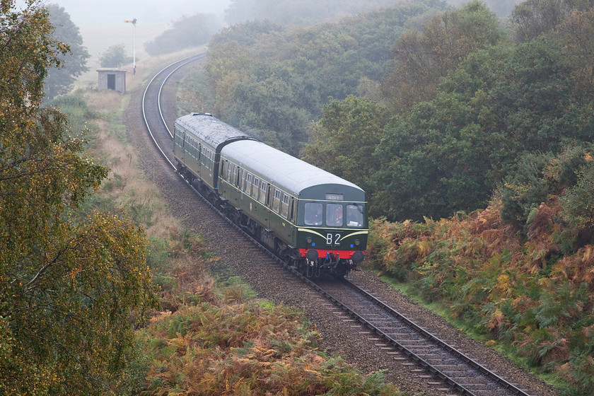 M51192 & M56352, 09.45 Sheringham-Holt, Kelling Bank 
 The first service of the day on the North Norfolk Railway climbs up Kelling bank formed by a class 101 DMU set made up of M51192 and M56352. After a clear and chilly night, the morning has dawned with some seasonal autumnal fog that added a certain atmosphere to the scene but that soon burned off as the sun got to work. 
 Keywords: M51192 M56352 09.45 Sheringham-Holt Kelling Bank