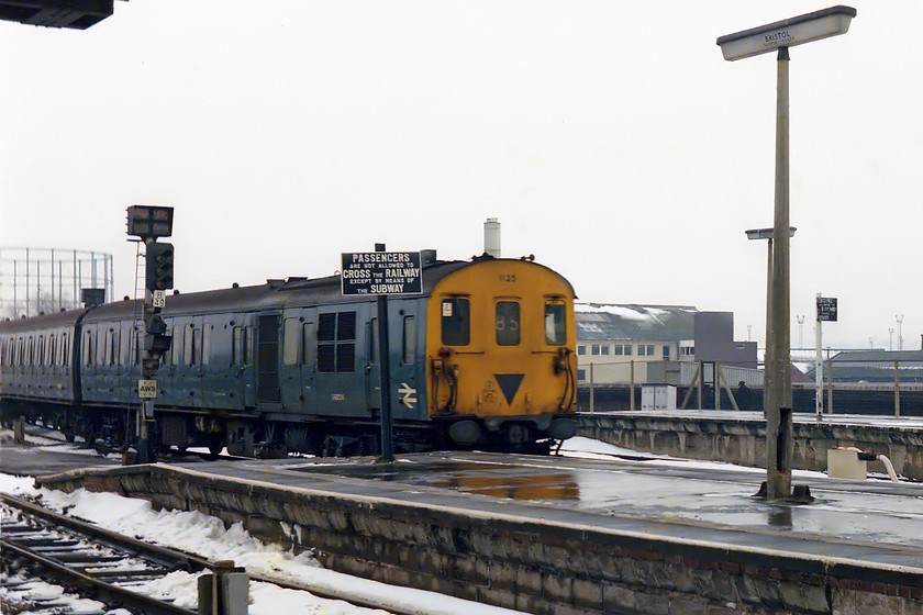 1125, unidentified Portsmouth Harbour-Bristol Temple Meads working, Bristol Temple Meads station 
 The snow is beginning to melt from the platforms at Bristol Temple Meads as a Southern Region DEMU arrives with a Portsmouth Harbour to Bristol working. It's 85 reporting number indicates a Portsmouth Harbour to Southampton or Romsey stopper working. By 1978 these English Electric powered units were not as common as they had been on these services, so Is suspect that the weather had a hand to play in this working. I was lucky enough to take this unit as my return train back to Bath a little later in the day. 
 Keywords: 1125 unidentified Portsmouth Harbour-Bristol Temple Meads working Bristol Temple Meads station