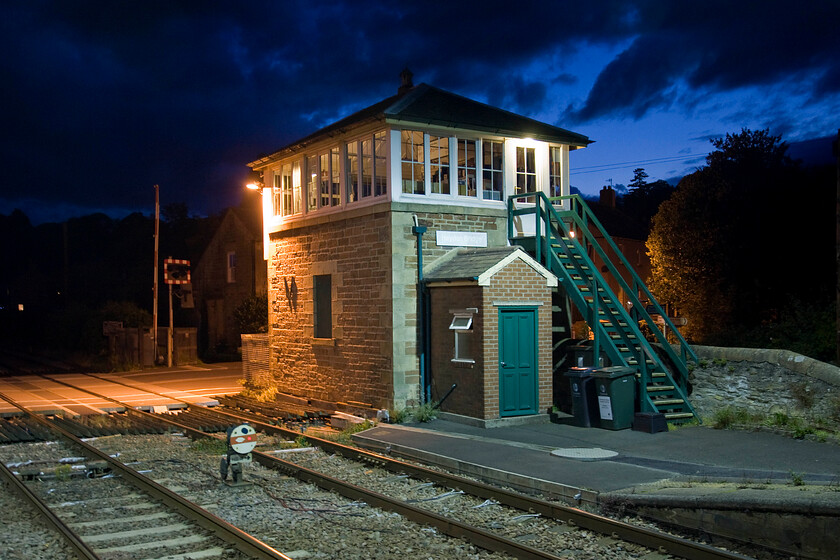 Haydon Bridge signal box (NE, 1877) 
 Taken from the platform end of Haydon Bridge station the superb 1877 North Eastern signal and crossing box is seen under an impressive evening sky. Notice the modern and luxurious personal needs addition at the bottom of the steps in the form of a toilet block! This box has a few years left in use until probably 2020 when the York signalling centre is due to take over control of the Tyne Valley line as far as Low Row box (the next one west from Haydon Bridge). 
 Keywords: Haydon Bridge signal box North Eastern Railway