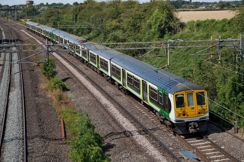 319467 & 319460, 14.36 Northampton EMD-Bletchley CS ECS (5B99), Victoria Bridge 
 Former Thameslink 319467 and 319460 pass Victoria Bridge just south of Roade on the WCML making the short journey from Northampton's Kingsheath Depot to Bletchley carriage sidings as the 5B99 ECS. London NorthWestern retains a small number of these units to augment their morning and evening commuter services, for the rest of the day are stabled out of use. 
 Keywords: 319467 319460 14.36 Northampton EMD-Bletchley CS ECS 5B99 Victoria Bridge