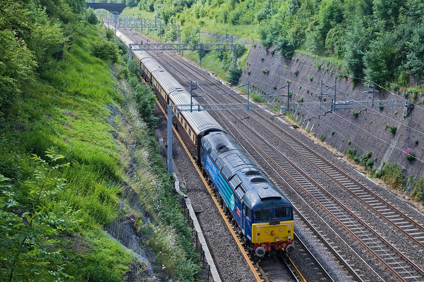 47805, return leg of Northern Belle GP Special, London Euston-Northampton-Willesden (1Z35), Roade cutting 
 47805 'John Scott 12.5.45-22.5.12' brings up the rear of the Northern Belle empty stock working from Northampton to Willesden as it passes southwards through Roade cutting. Having dropped its passengers making for the Silverstone Grand Prix at Northampton the train will be serviced and stabled in north London before returning later to collect them from Northampton. 
 Keywords: 47805 Northern Belle GP Special London Euston-Northampton-Willesden 1Z35 Roade cutting DRS Pride of Cumbria John Scott 12.5.45 - 22.5.12