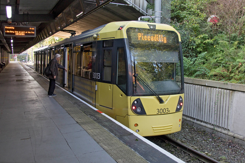 3003, Piccadilly-Bury, Bury Interchange 
 Metrolink tram 3003 has just arrived at Bury Interchange station and is already displaying its return destination. My wife and I travelled on this tram from Piccadilly station, from zone one to zone four. This was a fascinating journey that crossed Manchester and out through its suburbs that took just over half an hour. 
 Keywords: 3003 Piccadilly-Bury Bury Interchange