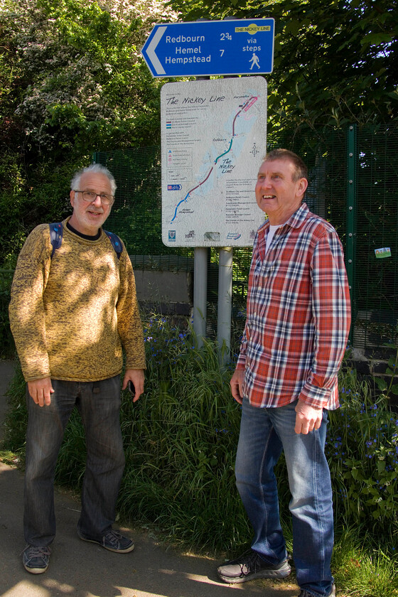 4. Andy & Mike, start of Nickey Line walk, Harpenden 
 The official start point of our Nickey Line walk in Harpenden. As can be seen from the sign, it was a seven-mile walk along the trackbed (for most of the route as there were a few sections where it had been built over) to Hemel Hempstead. The signage and information provided en route were generous and we found encouraging patronage of the walk by walkers and cyclists alike. 
 Keywords: Andy Mike the start of Nickey Line walk Harpenden