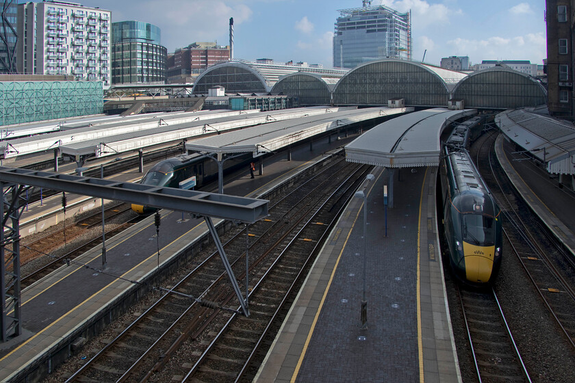 London Paddington, Bishop's bridge 
 I have never taken photographs from the famous Bishop's bridge that crosses the throat of Paddington station before. Unless you are extremely tall or have some steps you will need a camera with a flip-out screen that can be held at arm's length over the parapet as I did in this case. This view shows two GWR IETs waiting to leave for the West Country from platforms two and five. The new Bishop's bridge opened in June 2006 following its replacement of the famous cast-iron Paddington bridge that is now in storage and in the care of English Heritage at Fort Cumberland, near Portsmouth. The row around the demolition of the old bridge back in 2003 made a mockery of the planning rules with a palpable lack of communication between all parties concerned. 
 Keywords: London Paddington Bishop's bridge.