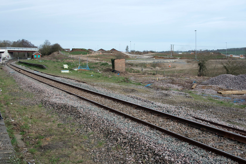 Former platform five, Wellingborough station 
 A wide-angle picture from the southern end of Wellingborough station reveals the initial stages of the work to reinstate the former platform five. Access roads have been started but there is no other evidence of construction. The area to the right will be the location for a new station building, retailing and car parking. All this development is linked to the huge new housing development, named Stanton Cross, that will dominate the eastern side of Wellingborough increasing the town's size by about a third. 
 Keywords: Former platform five Wellingborough station