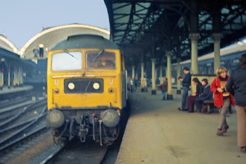 0008-Class-0047,-unidnetified-up-working,-York-Station 
 An afternoon Class 47 arrival at York station does not impress many of the platform end spotters. Indeed, my friend Duncan, sporting the red coat, totally ignores it and having a laugh with our mates. I have no record of this class 47 or its up working.