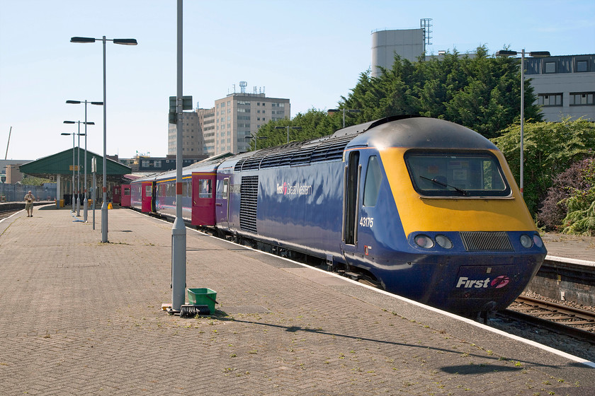 43175, GW 13.28 Swansea-London Paddington (1L66), Swansea station 
 Basking in the hot summer sun, 43175 'GWR 175th Anniversary' is being cleaned and prepared at Swansea station in order to work 1L66 or 13.28 to London Paddington. The rear power car, out if sight at Swansea's buffer blocks, was 43139 'Driver Stan Martin 25 June 1950-6 November 2004'. Andy can be seen to the left of this image walking up the platform to join me. 
 Keywords: 43175 13.28 Swansea-London Paddington 1L66 Swansea station