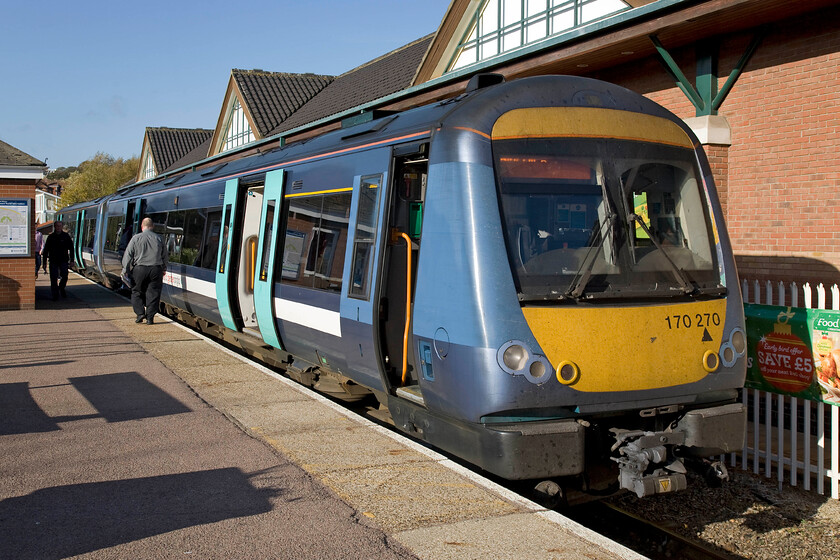 170270, LE 09.46 Sheringham-Norwich (2S09), Cromer station 
 Two-car 170270 waits at Cromer station whilst the driver walks to the other end of the train to continue its journey to Norwich. My wife and son always get a little anxious when I hop off the train to take a photograph of a train despite my reassurance here at Cromer that I will have at least three minutes! 
 Keywords: 170270 09.46 Sheringham-Norwich 2S09 Cromer station Greater Anglia