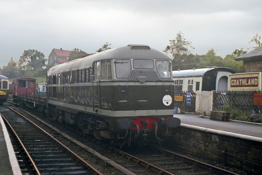 D5500, down freight, Goathland station 
 Back at Goathland after our family walk, type 3 D5500 arrives with a freight working from the Pickering direction. D5500 had only been withdrawn from service as 31018 two years previously after being in service on the Eastern Region for some 18 years. This locomotive is still with us today being on-display at the National Railway Museum in York. Now, it is painted back into its BR blue paint scheme and carrying its TOPS number of 31018, see....... https://www.ontheupfast.com/p/21936chg/30013280894/x19-31018-preserved-nrm 
 Keywords: D5500 freight Goathland station