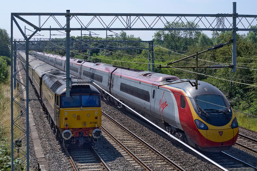 47790, the outward leg of The Northern Belle, 07.07 Liverpool Lime Street-Kensington Olympia (1Z52) & 390130, VT 09.15 Manchester Piccadilly-London Euston (1A19), Bradwell SP831391 
 47790 'Galloway Princess' brings up the rear of The Northern Belle charter past Bradwell in Milton Keynes. It left Liverpool Lime Street at 07.07 and was heading for Kensington Olympia. Passing the charter is a Virgin Pendolino working the 09.15 Manchester Piccadilly to Euston train. 
 Keywords: 47790, the outward leg of The Northern Belle, 07.07 Liverpool Lime Street-Kensington Olympia (1Z52) & 390130, VT 09.15 Manchester Piccadilly-London Euston (1A19), Bradwell SP831391 Virgin Pendolino Galloway Princess