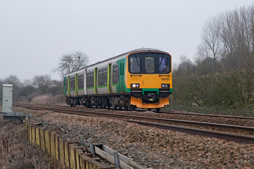 150107, LM 08.31Bedford-Bletchley (2S06, 1E), Lidlington SP982387 
 150107 forms the 08.31 Bedford to Bletchley working just west of the village of Lidlington in the Marston Vale. This picture is taken from a public foot crossing, one a small number in this area that still allow legal and safe lineside access for photographic purposes. 
 Keywords: 150107 2S06 Lidlington SP982387