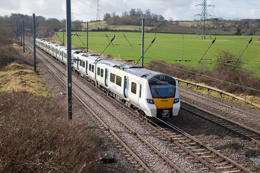 700003, TL 08.02 Beckenham Junction-Bedford (1G63, 2E), Millbrook TL020397 
 700003 is close to completing its journey from Beckenham Junction as it passes Millbrook just south of Bedford. There is no doubting that theses units have increased capacity on this busy route but these units have also been blighted by comments regarding their seating (like the class 800s on the Western). Also, Thameslink's controversial 're-timetabling' exercise has caused great inconvenience to many passengers so, altogether, not the best opening few months for a brand new class! 
 Keywords: 700003 1G63 Millbrook TL020397